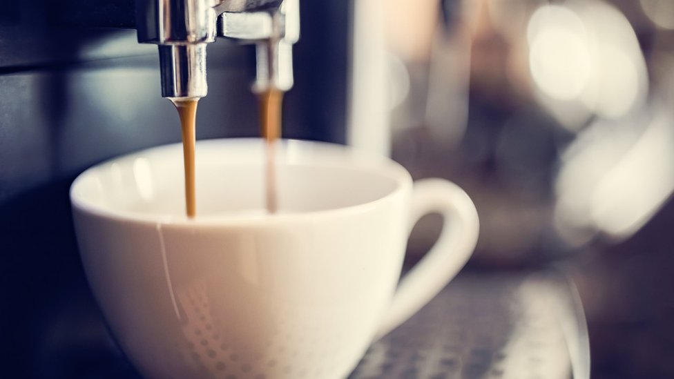 Espresso machine making fresh cup of coffee