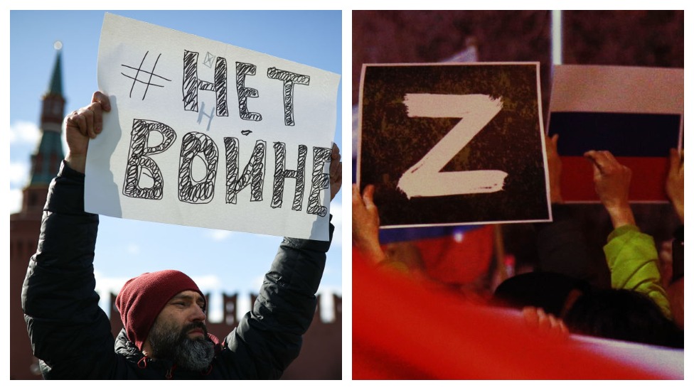 Two protest signs held up by demonstrators