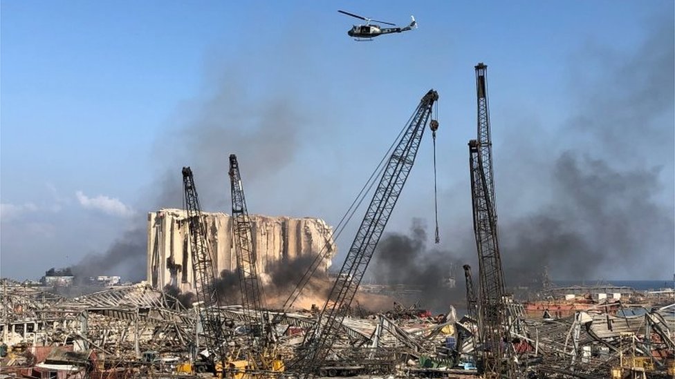 A Lebanese army helicopter flies over the site of Tuesday`s blast in Beirut`s port area, Lebanon August 5, 2020