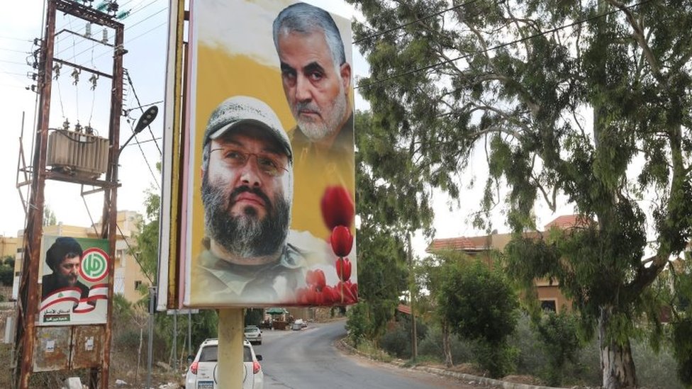 A banner showing the late Hezbollah military commander Imad Mughniyeh and the late Iranian general Qasem Soleimani in Ain Qana, Lebanon (22 September 2020)