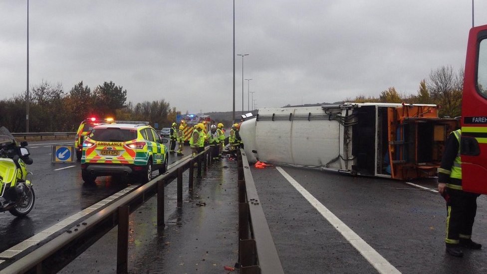 Three hurt as bin lorry overturns on M27 near Cosham BBC News