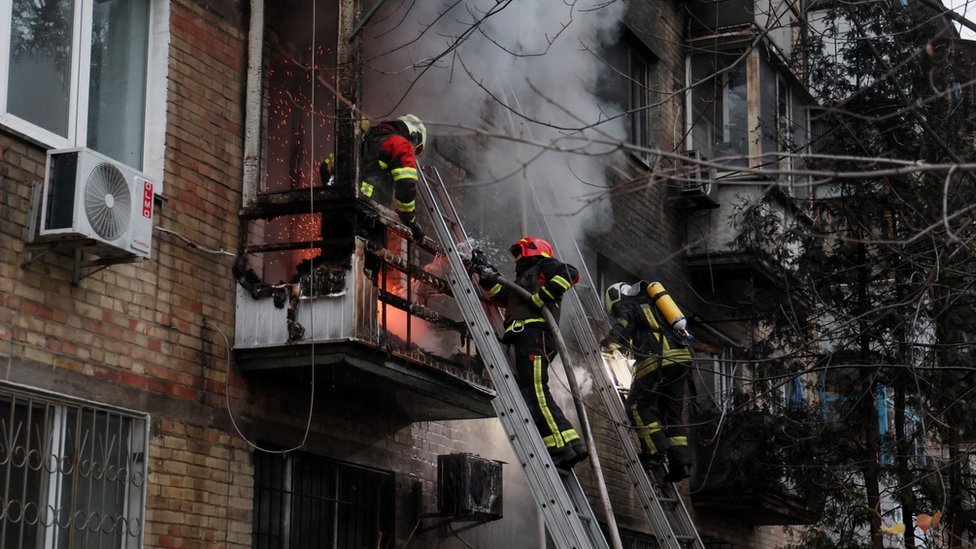 Firefighters work to put out a fire in a residential building hit by a Russian missile strike, amid Russia's attack on Ukraine, in Kyiv, Ukraine