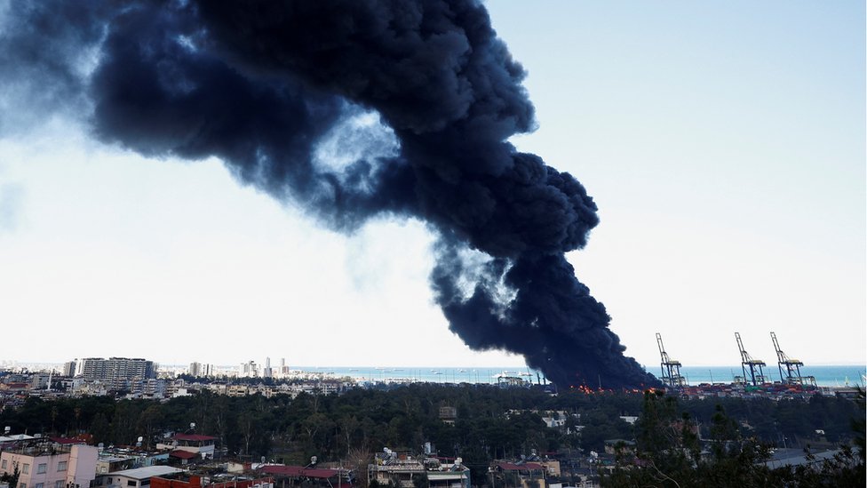 Smoke rises from a fire at the port of Iskenderun following an earthquake in Turkey