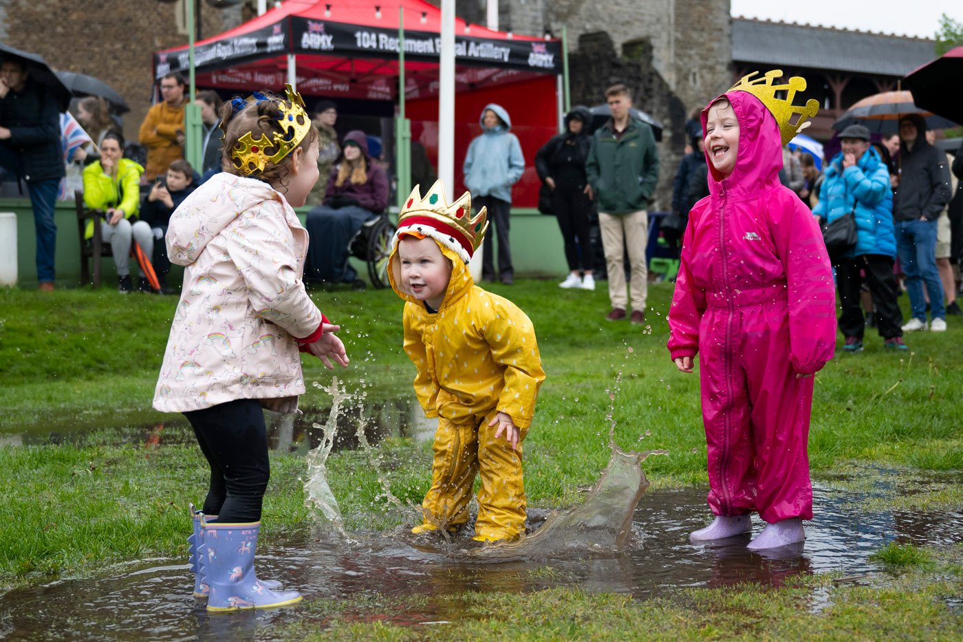 Children play in the grounds of Cardiff Castle during the coronation ceremony