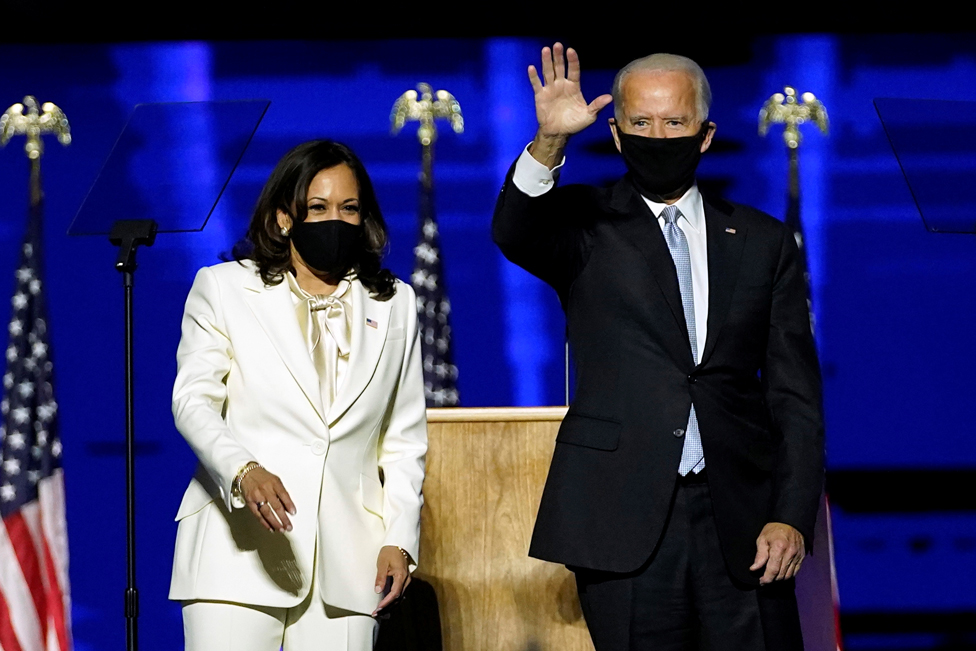 Kamala Harris and Joe Biden wave at supporters