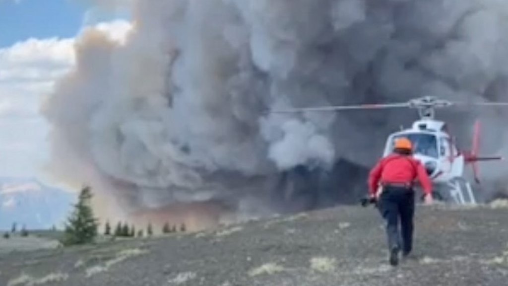 A dramatic helicopter rescue for three hikers trapped by wildfire in Canada