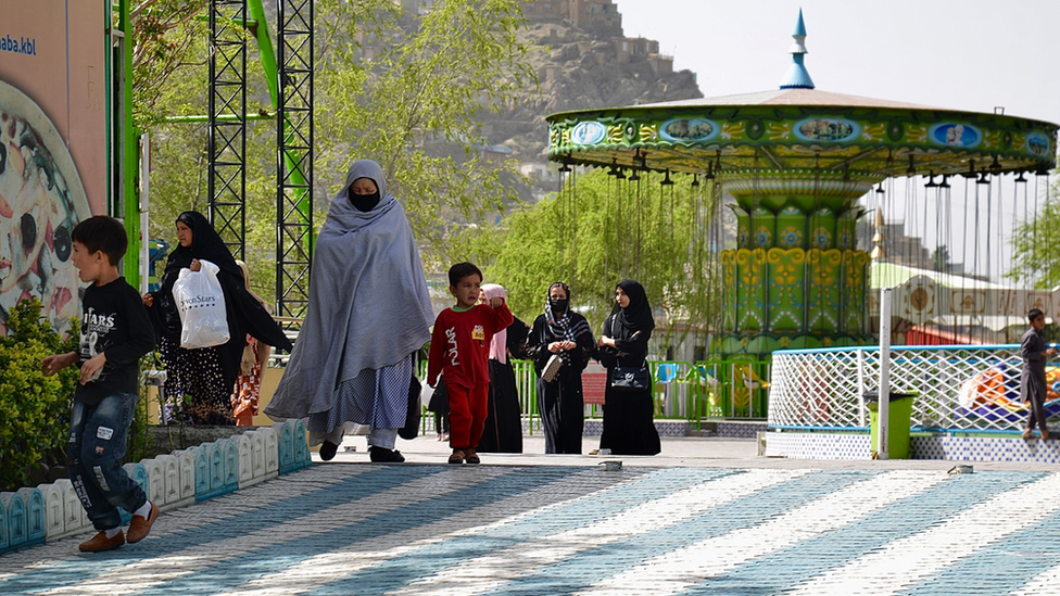 Afghan people visit an amusement park in Kabul on March 28, 2022.