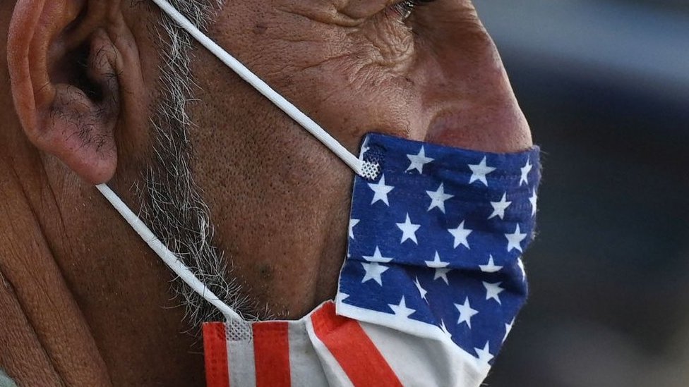 Man wearing US flag mask