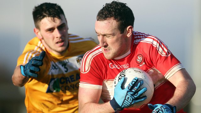 Antrim's Conor Burke tackles Derry's man of the match Shane Heavron at Owenbeg