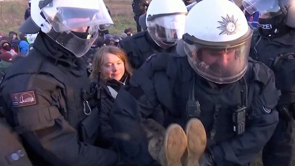 Greta being carried by police