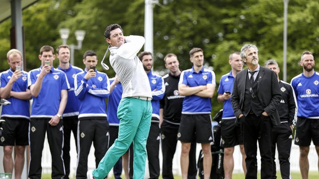 Northern Ireland players watch McIlroy in action