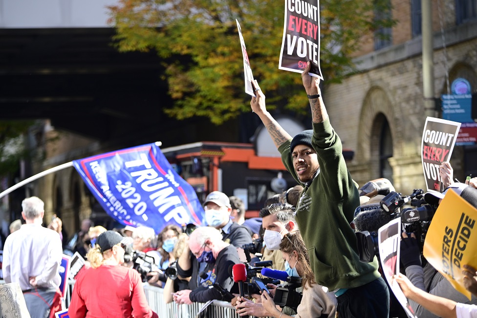 Supporters of Democratic candidate Joe Biden and Republican candidate Donald Trump face each other as hundreds gather outside the central ballot counting location at the Pennsylvania Convention Center in Philadelphia, PA on 5 November 2020 in anticipation of the results of he historic US Presidential Elections.