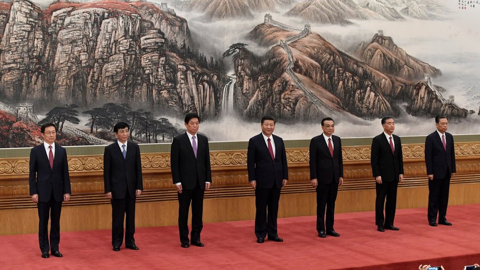The Communist Party of China's new Politburo Standing Committee, the nation's top decision-making body (L-R) Han Zheng, Wang Huning, Li Zhanshu, Chinese President Xi Jinping, Premier Li Keqiang, Wang Yang and Zhao Leji meet the press at the Great Hall of the People in Beijing on October 25, 2017.