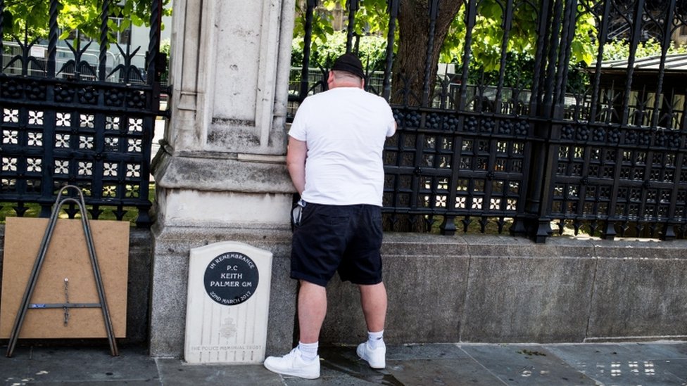 A man appearing to urinate on PC Keith Palmer's memorial