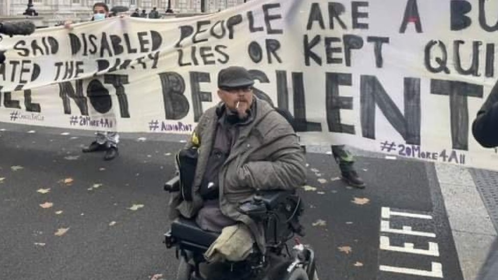 Andy Greene in his wheelchair at Disabled People Against Cuts protest