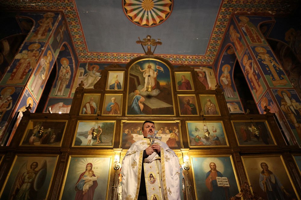 A Bosnian Orthodox priest Marko Males leads a mass on the eve of Orthodox Christmas in Church of the Holy Mother of God in Zenica, Bosnia and Herzegovina