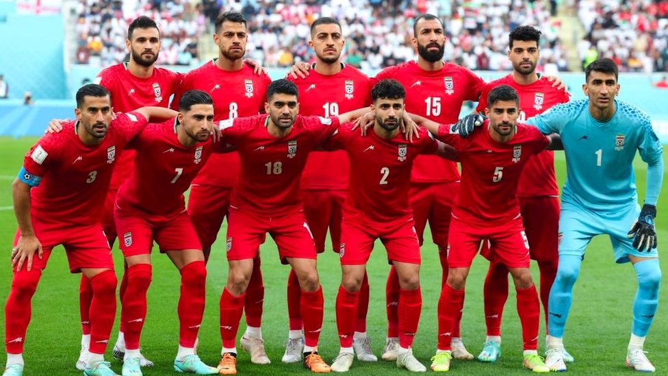 Iran's football team poses for a photo before their first match in the World Cup against England