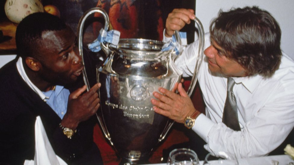 Bernard Tapie and Basile Bodi holding football championship cup
