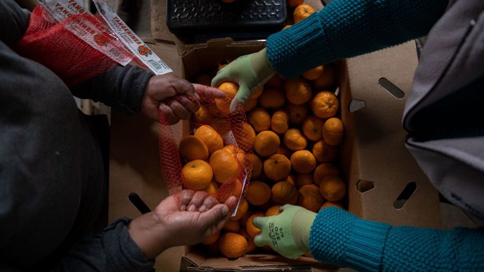 Vendedores de naranjas