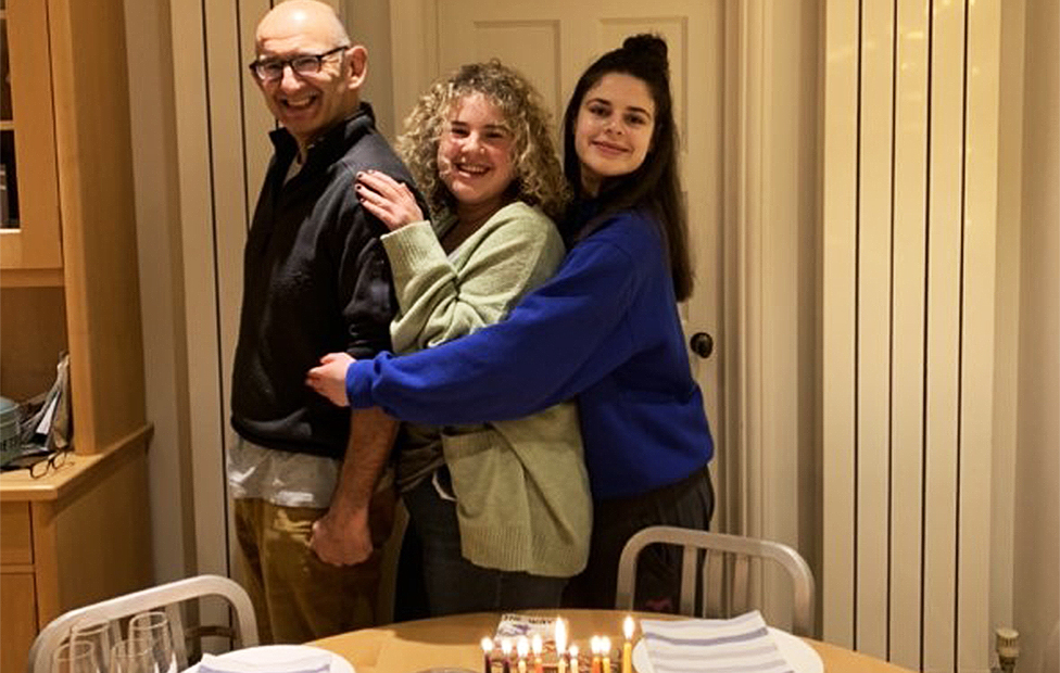 Hannah with her sister and Dad on Hanukkah