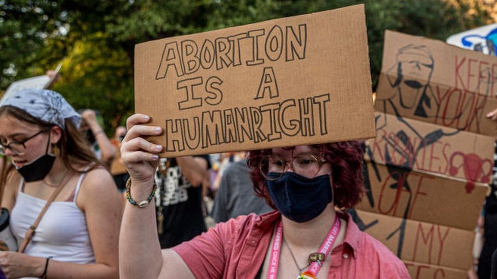 Pro-choice protesters march outside the Texas State Capitol on Wednesday on 1 September