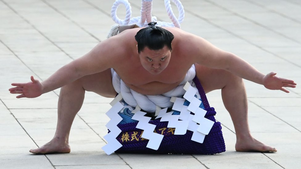 Hakuho: Top sumo champion demoted due to proteges violence