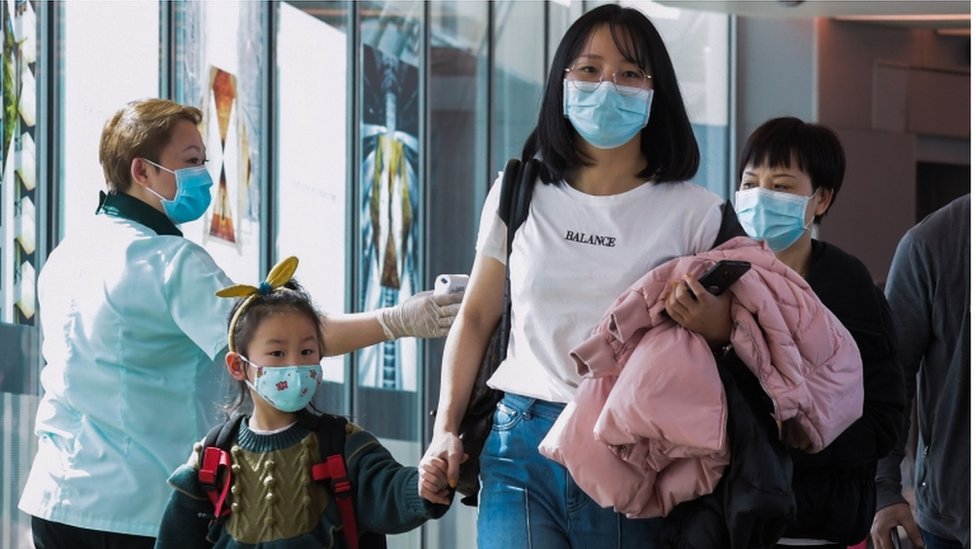 arriving passengers from China at Changi International airport in Singapore on January 22, 2020