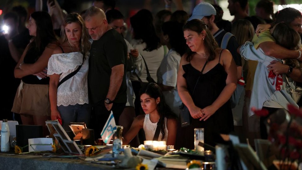 People react as they attend a gathering to support families of hostages held in Gaza, marking one year since the October 7 attack by Hamas during which their loved ones were taken hostage, in Tel Aviv, Israel, October 7, 2024.