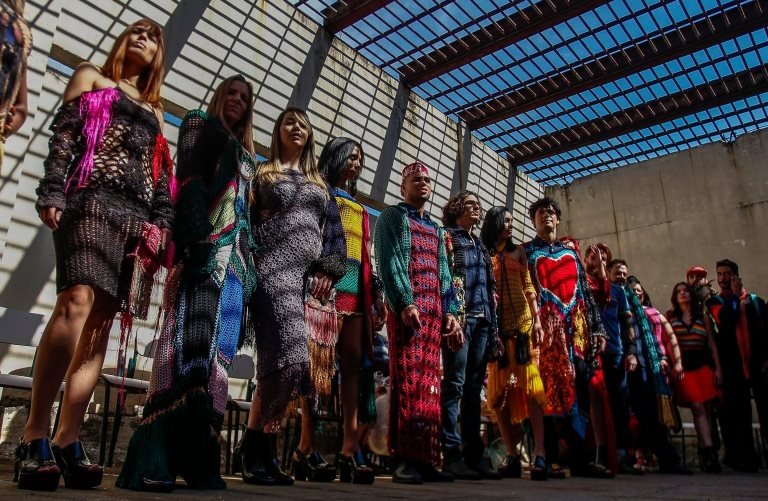 Models present crochet clothing creations made by inmates as part of "Ponto Firme" project in the Adriano Marrey maximum security penitentiary in Guarulhos, Brazil on May 22, 2019.