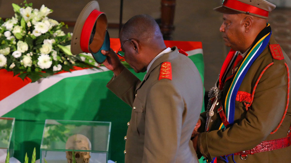 Members of a Namibian delegation attend a ceremony in Berlin, Germany, for the returning of human remains