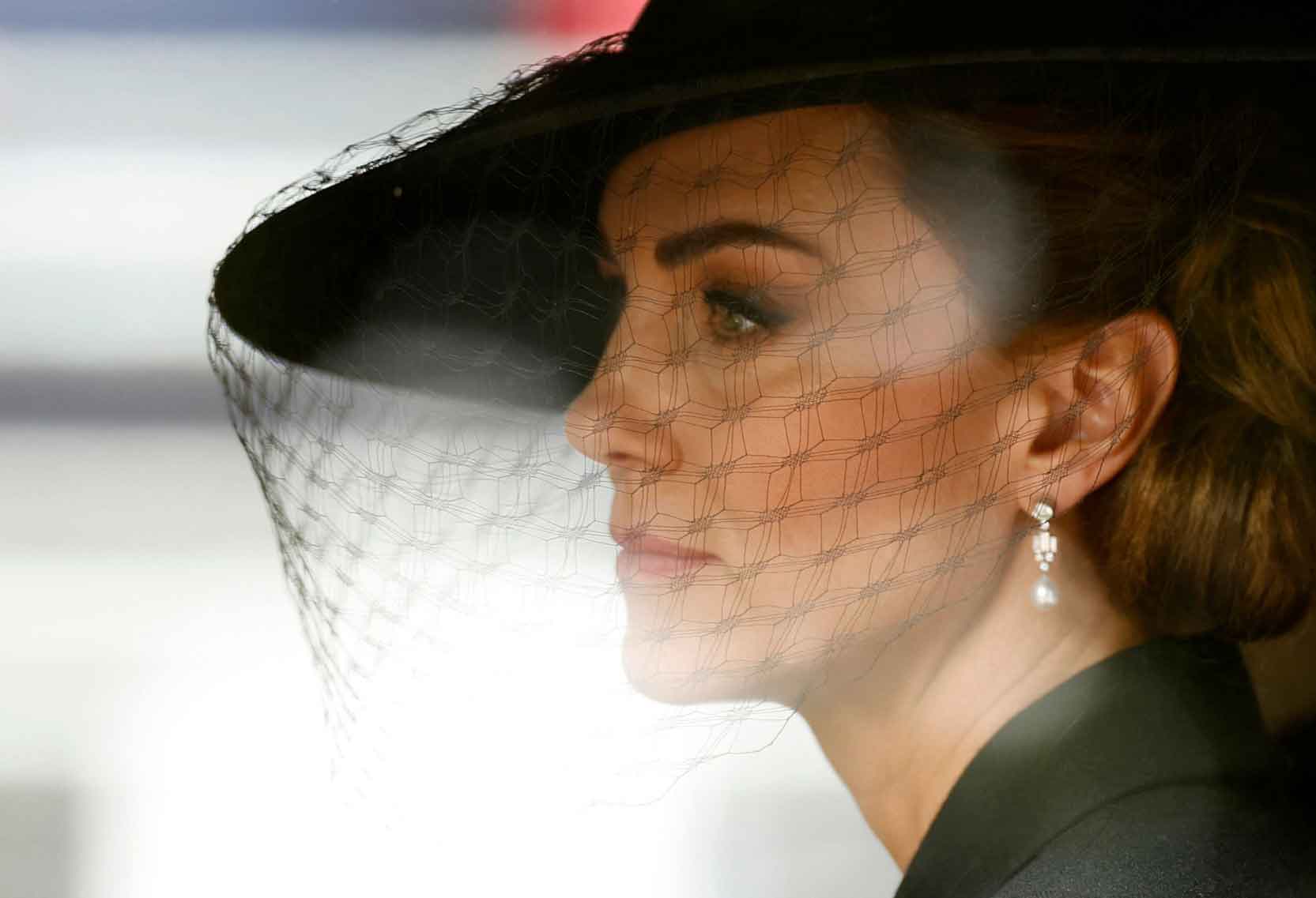 The Princess of Wales wearing a hat with a black veil.