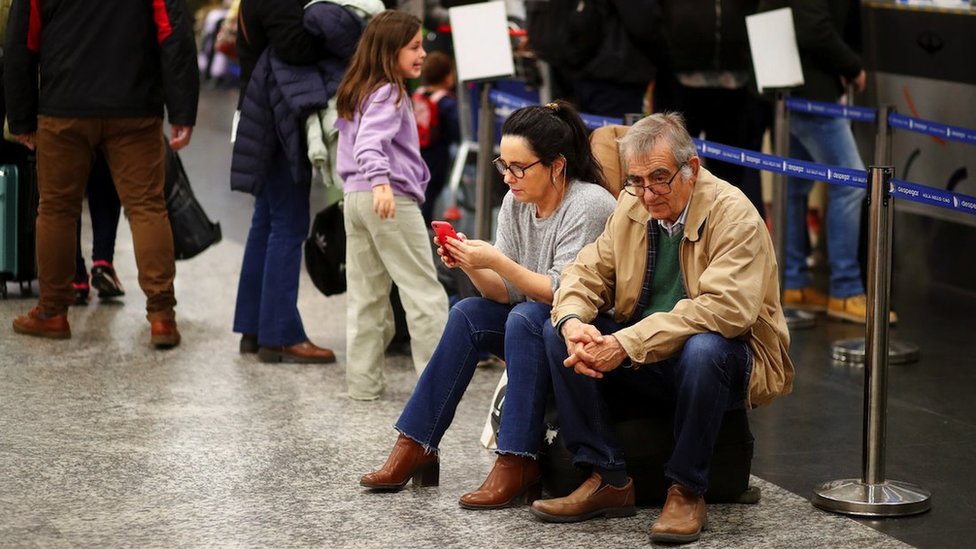Passangers wait at the Aeroparque Jorge Newbery airport as flights were cancelled due a porters' strike, in Buenos Aires, Argentina August 15, 2023. REUTERS/Agustin Marcarian