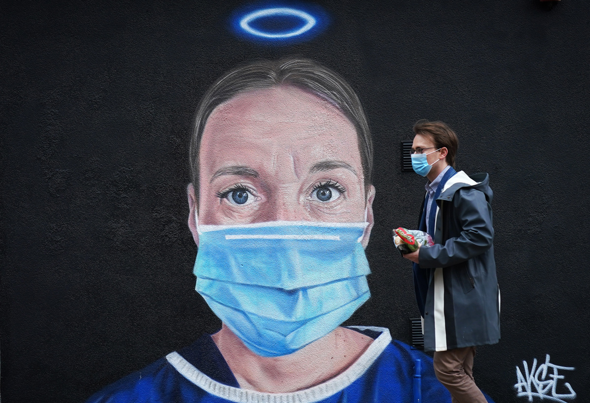 A mural by street artist Akse depicting an NHS nurse with a halo adorns - Manchester's northern quarter on June 03, 2020