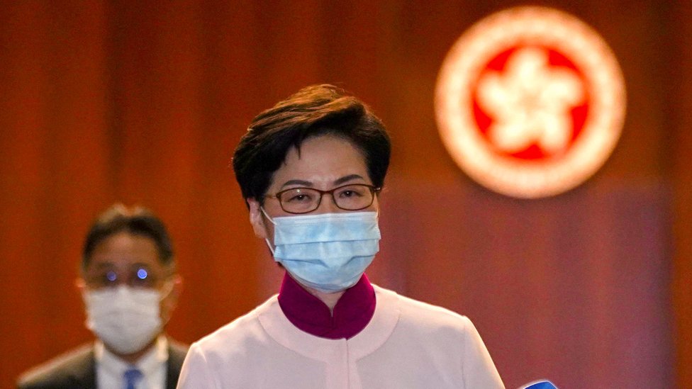 Hong Kong Chief Executive Carrie Lam reacts as she leaves the chamber after delivering her final annual policy address at the Legislative Council in Hong Kong, China October 6, 2021.