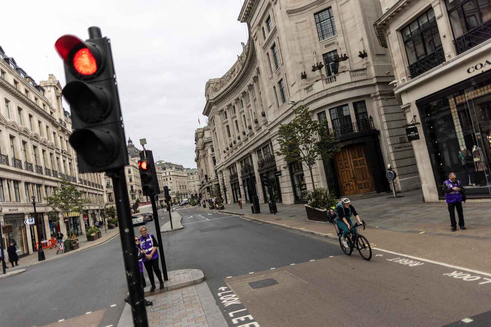 London's traffic lights flashed red at empty streets.