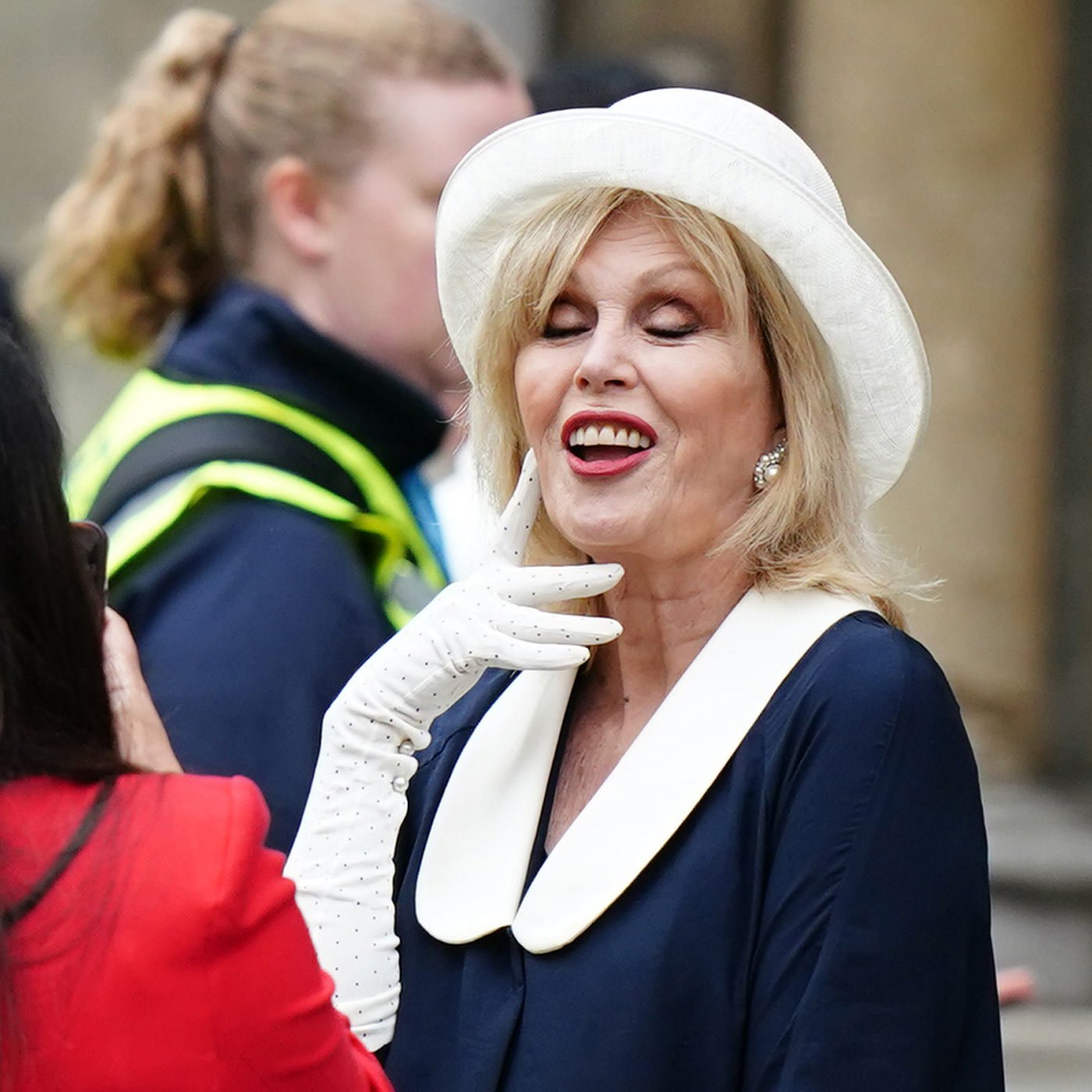 Dame Joanna Lumley poses for a photograph as she arrives at Westminster Abbey