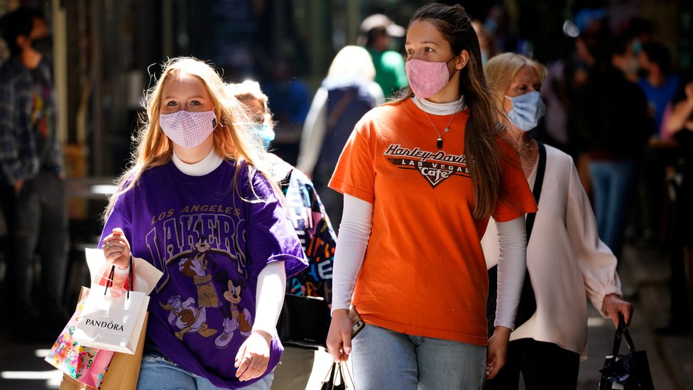 Shoppers walk with masks in Melbourne on 28 October 2020