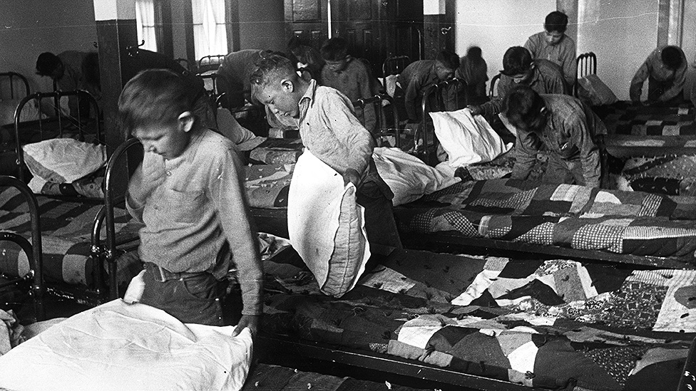 Children in a residential school dormitory in the 1950s