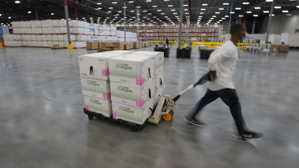 Boxes containing the Moderna COVID-19 vaccine are prepared to be shipped at a distribution center in Olive Branch, Mississippi, USA, December 2020