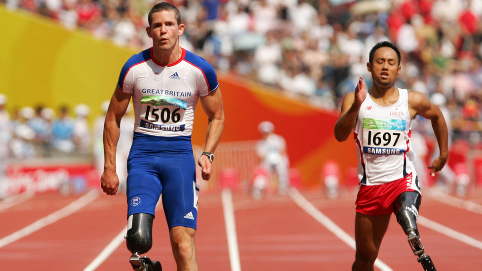 John McFall competing at the 2008 Paralympic Games in the Men's 100m T42 Final Athletics event