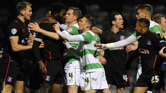 Yeovil and Carlisle players clash during their FA Cup third-round replay