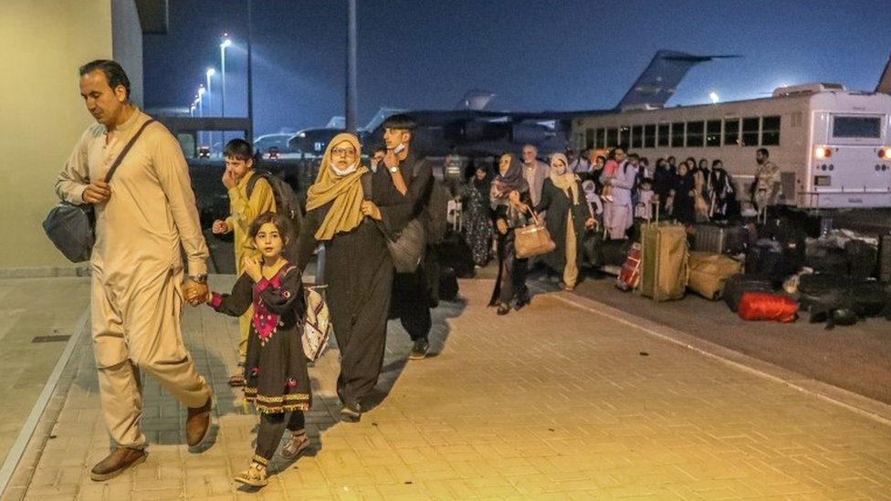 Evacuees from Afghanistan arrive at Al-Udeid airbase in Doha, Qatar (17 August 2021)