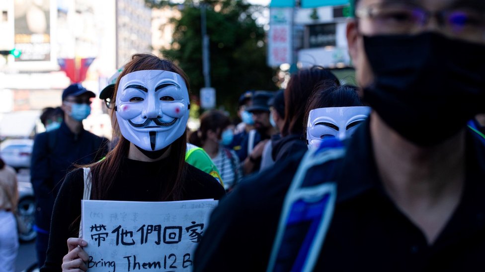 A protester wears Vendetta mask during the march to demand the release of 12 Hong Kong detainees in Taipei, Taiwan, on October 25, 2020.