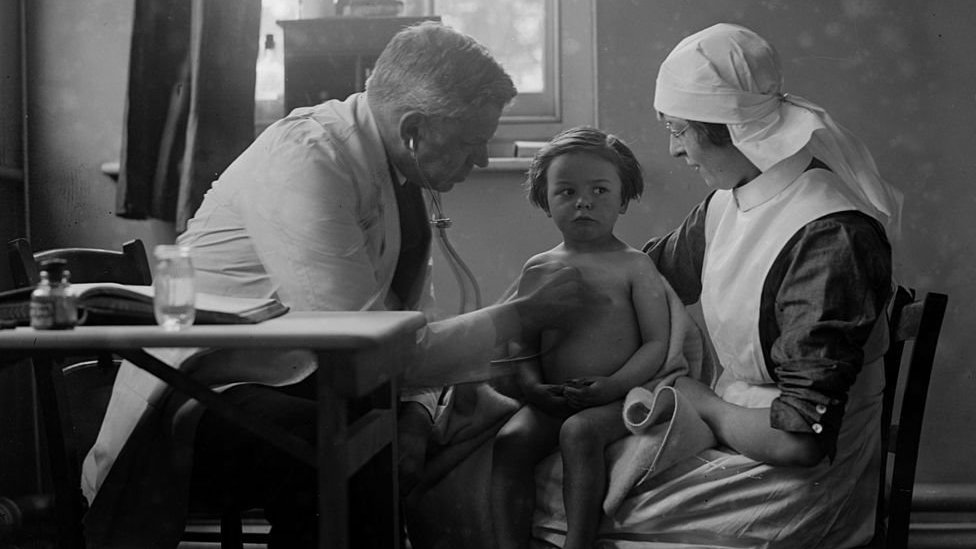 Doctor examining a child