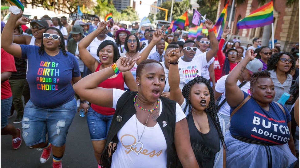Members of the South African Lesbian, Gay, Bisexual and Transgender and Intersex (LGBTI) community chant slogans as they take part in the annual Gay Pride Parade, as part of the three-day Durban Pride Festival, on June 24, 2017 in Durban.