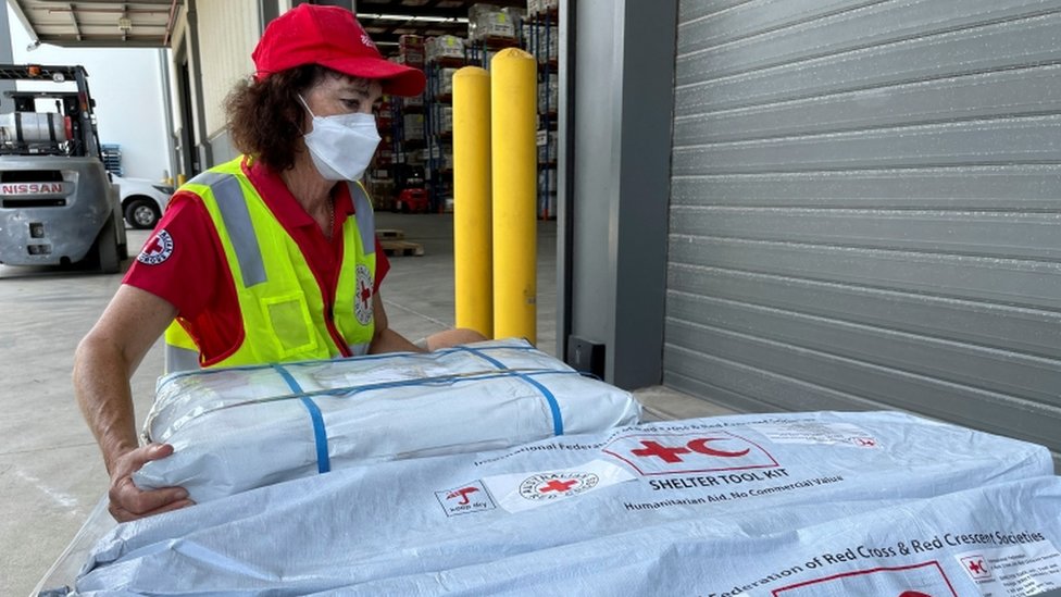 Supplies intended as relief material are prepared to be sent to Tonga by the Australian Red Cross, in Brisbane