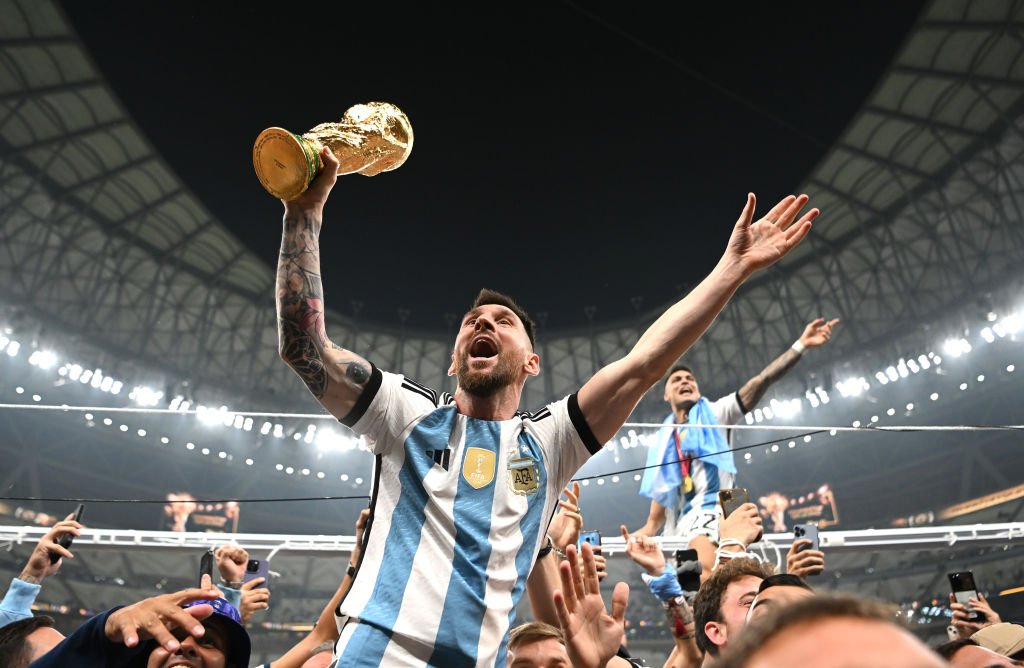 Lionel Messi, of Argentina, celebrates with the World Cup trophy after winning the 2022 final in Qatar - at Lusail Stadium on 18 December 2022.
