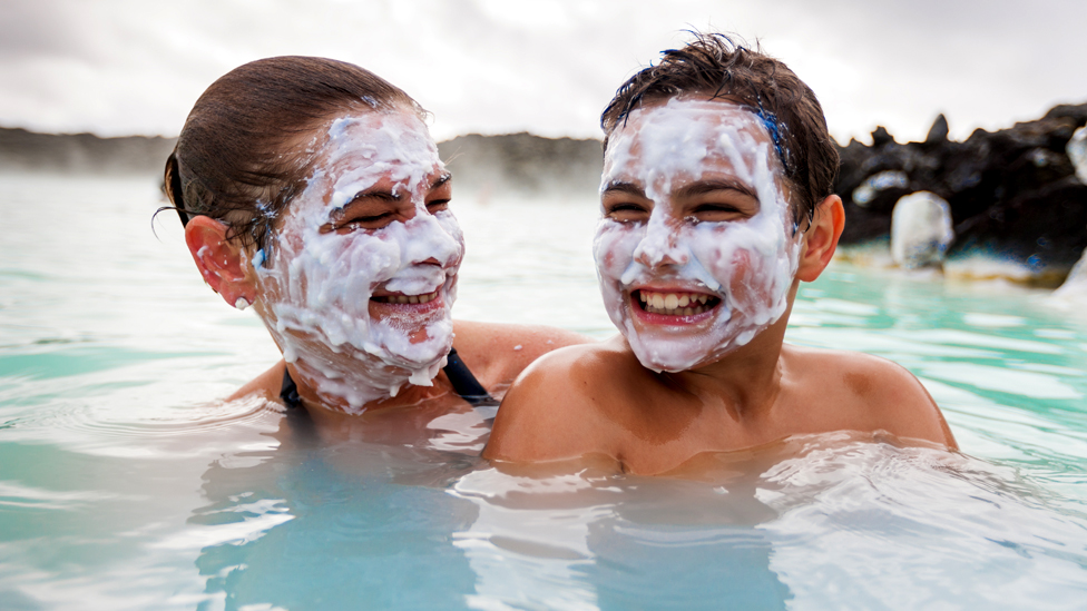 Mother and son at the Blue Lagoon, Iceland.