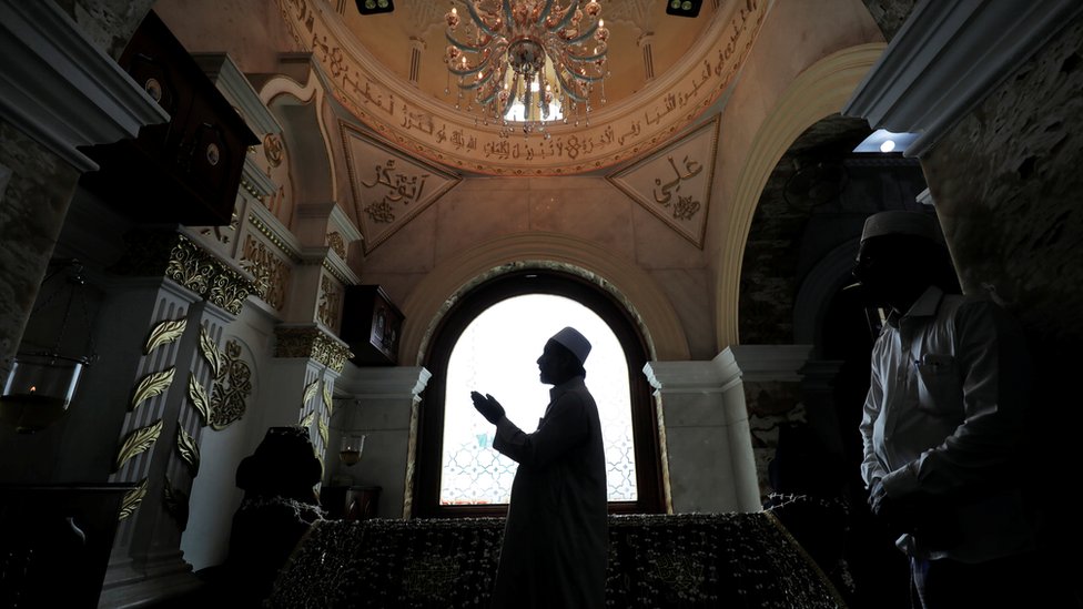A Muslim priest prays during Eid al-Fitr to mark the end of the holy fasting month of Ramadan at Dewatagaha Mosque in Colombo, Sri Lanka on 24 May 2020