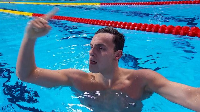 James Guy celebrates after clinching relay gold for Team GB
